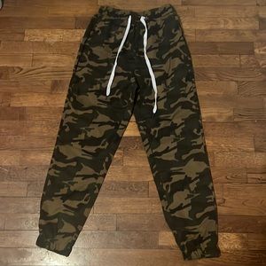 Green camo pants with drawstring. No stains or rips in the material